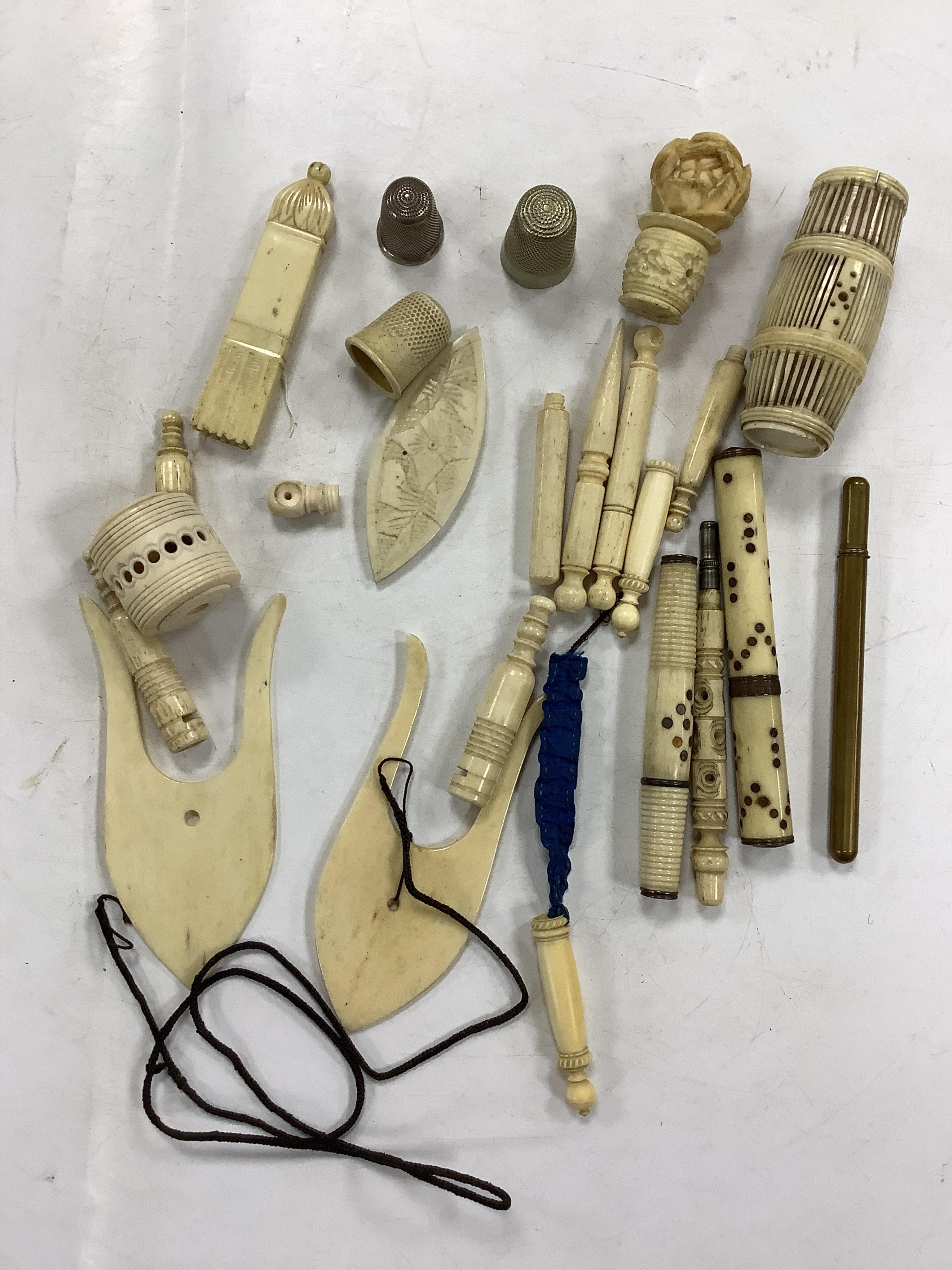 A collection of early 19th century and later bone needlework bodkin cases, two thimbles etc. Condition- some wear and a few items cracked